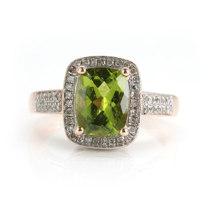 Lot 157 - A peridot and diamond cluster ring