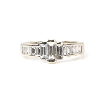 Lot 263 - An 18ct white gold baguette cut diamond ring