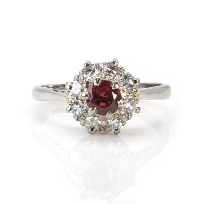 Lot 92 - A ruby and diamond cluster ring