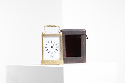 Lot 383 - A gilt-brass and bevelled glass carriage clock