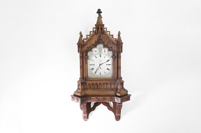 Lot 519 - A Victorian Gothic Revival oak bracket clock