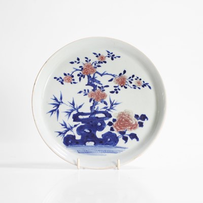 Lot 20 - A Chinese copper-red and underglaze blue plate