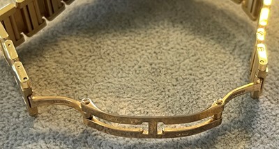 Lot 359 - A ladies' 18ct gold Cartier Tank Francaise quartz bracelet watch