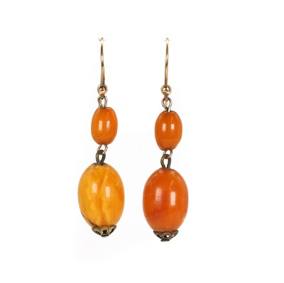 Lot 38 - A pair of butterscotch amber drop earrings