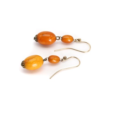 Lot 38 - A pair of butterscotch amber drop earrings