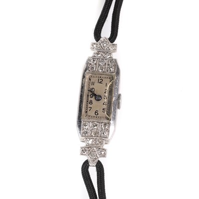 Lot 413 - An Art Deco diamond cocktail strap watch