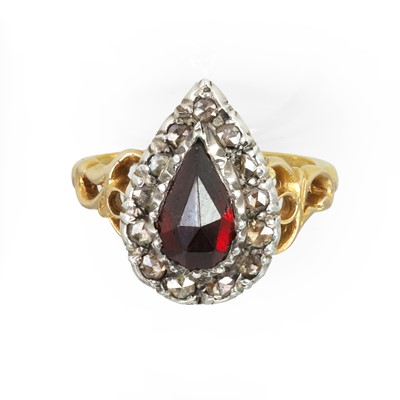 Lot 54 - A garnet and diamond cluster ring