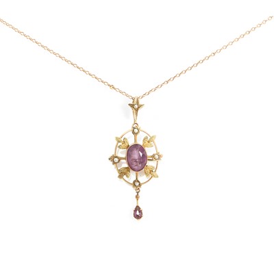 Lot 20 - An Edwardian amethyst and split pearl drop pendant/brooch