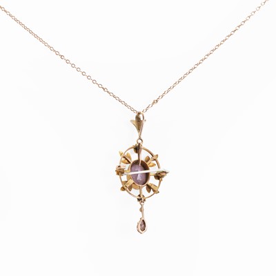 Lot 20 - An Edwardian amethyst and split pearl drop pendant/brooch
