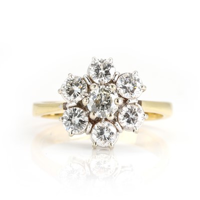 Lot 203 - An 18ct yellow and white gold seven stone diamond cluster ring