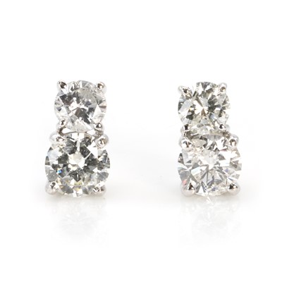 Lot 168 - A pair of two stone diamond stud earrings