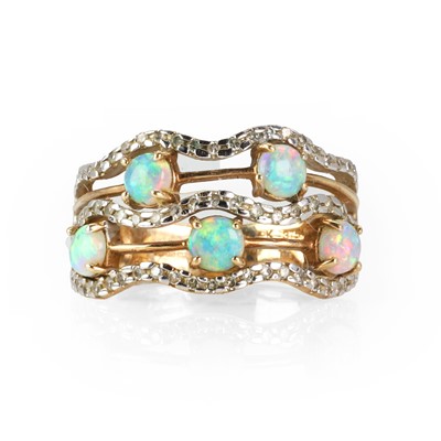 Lot 144 - A 9ct gold five row opal and diamond band ring