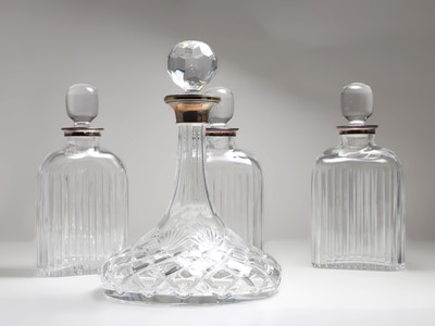 Lot 55 - A set of three continental silver and glass decanters