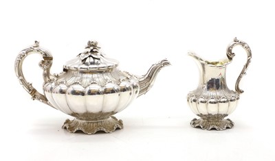 Lot 51 - A silver teapot and similar milk jug