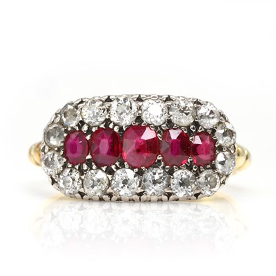 Lot 60 - An Edwardian ruby and diamond three row cluster ring