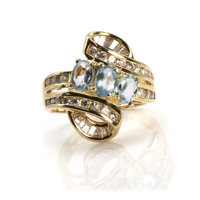 Lot 271 - An 18ct gold aquamarine and diamond ring