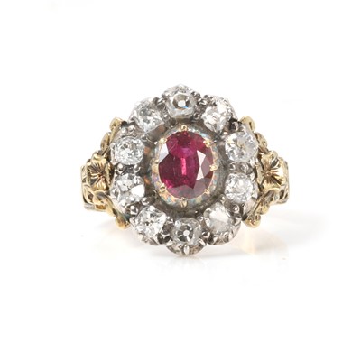 Lot 17 - A ruby and diamond cluster ring