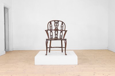 Lot 524 - A George III yew and elm Gothic Windsor armchair