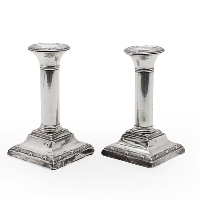 Lot 55 - A pair of silver column candlesticks