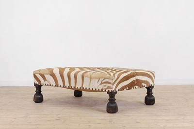 Lot 247 - A stained wood and zebra-skin stool