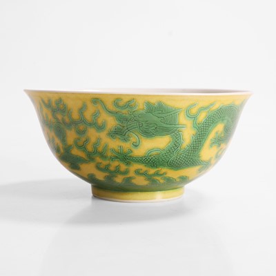Lot 309 - A Chinese yellow ground and green-enamelled bowl