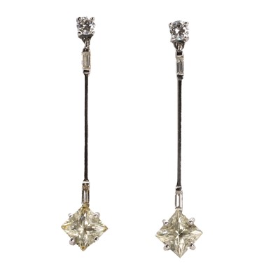 Lot 219 - A pair of white gold yellow sapphire and diamond earrings