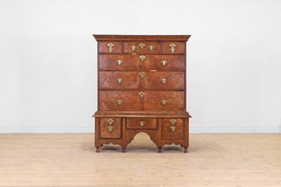 Lot 129 - A walnut chest-on-stand