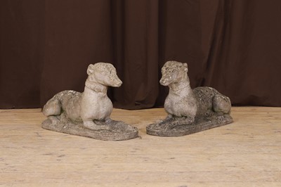 Lot 644 - A pair of composition stone hounds