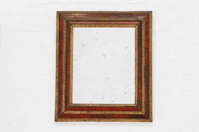 Lot 552 - A baroque-style tortoiseshell and parcel-gilt wooden mirror