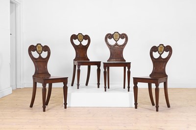 Lot 231 - A set of four Regency mahogany hall chairs