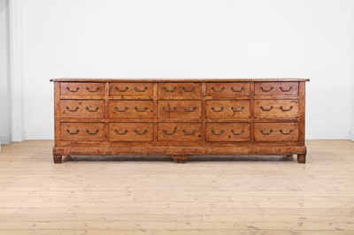 Lot 457 - A large provincial pine and fruitwood low dresser