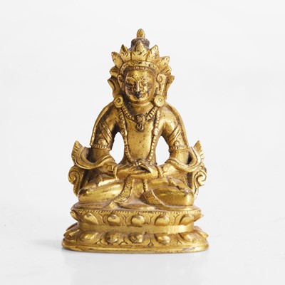 Lot 145 - A Tibetan gilt-bronze miniature bodhisattva