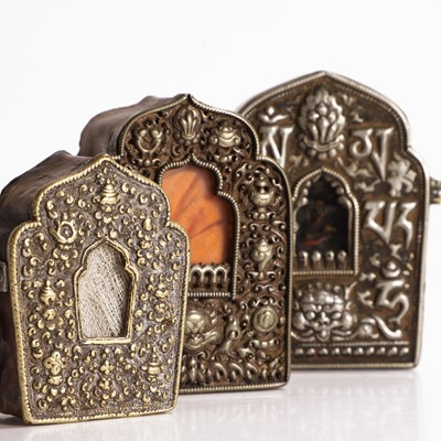 Lot 49 - Three Tibetan white-metal alloy travel shrines