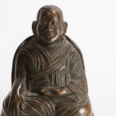 Lot 146 - A Tibetan bronze lama