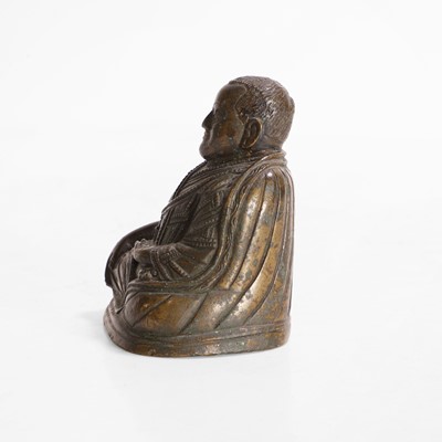 Lot 146 - A Tibetan bronze lama