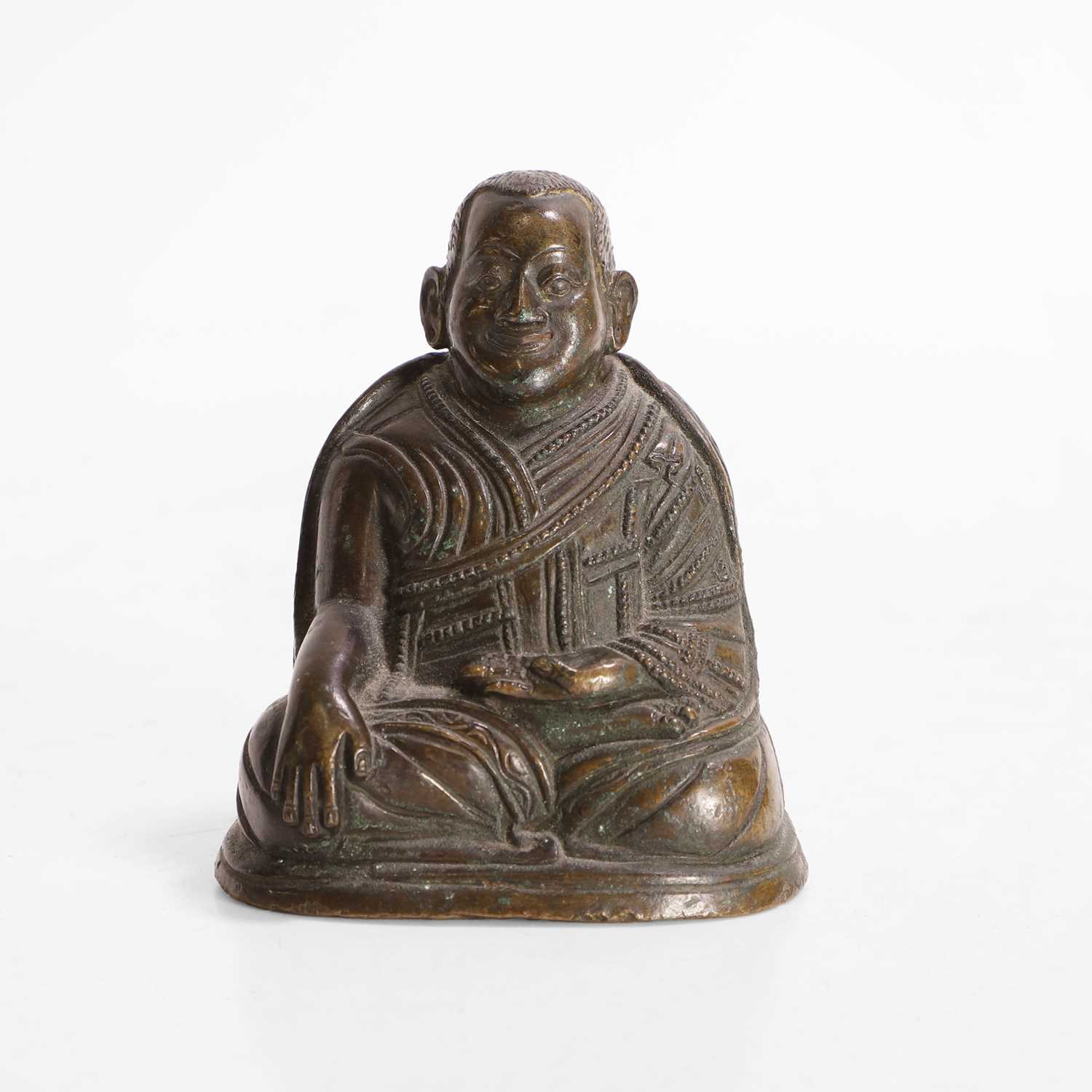 Lot 146 - A Tibetan bronze lama