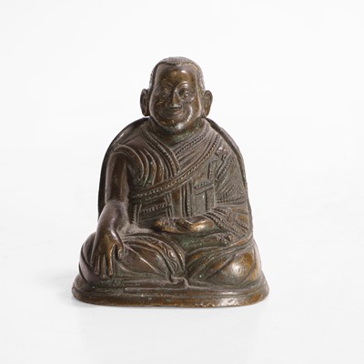 Lot 146 - A Tibetan bronze lama