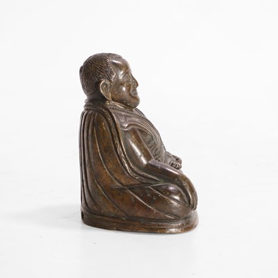Lot 146 - A Tibetan bronze lama