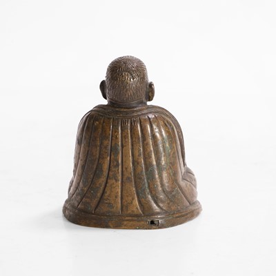 Lot 146 - A Tibetan bronze lama