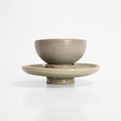 Lot 258 - A Chinese celadon-glazed teacup and a cup stand