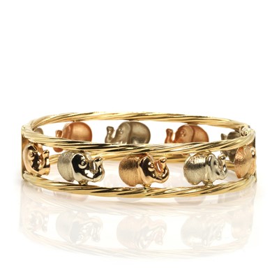 Lot 212 - A bicoloured gold hinged bangle