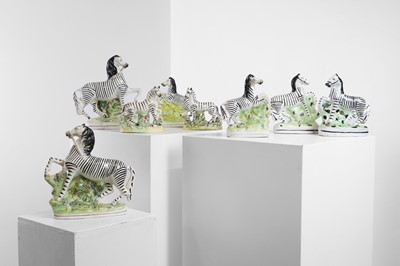 Lot 148 - A group of pottery zebras