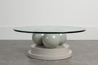 Lot 209 - A lacquered and glass coﬀee table