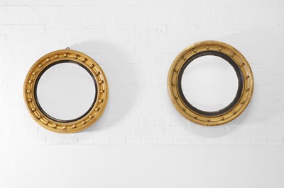 Lot 568 - Two Regency-style giltwood convex mirrors