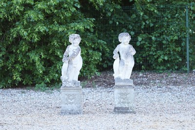Lot 622 - A pair of carved limestone cherubs