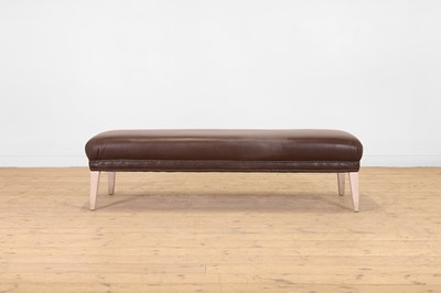 Lot 133 - A studded leather and limed wooden stool or bench