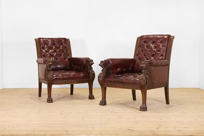 Lot 356 - A pair of Regency-style carved beech and buttoned leather library bergère armchairs
