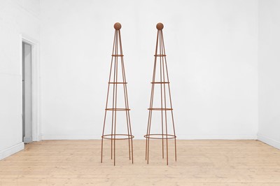 Lot 633 - A pair of metal garden obelisks