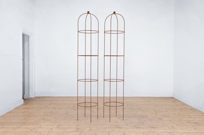 Lot 647 - A pair of metal garden obelisks