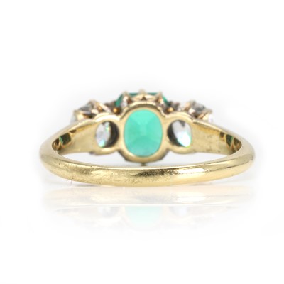 Lot 250 - An emerald and old cut diamond three stone ring